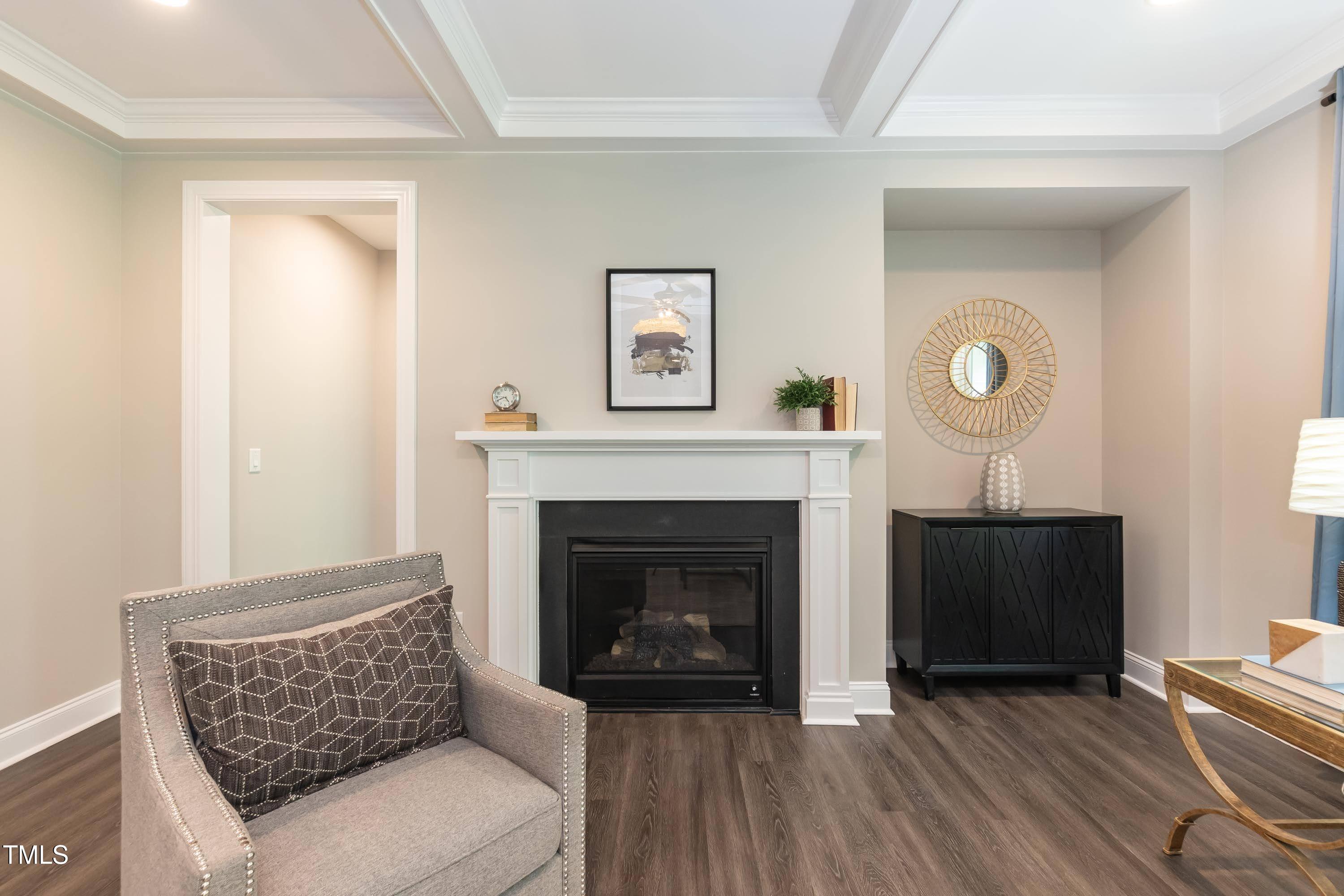 273 Scarlet Tanager Circle Holly Springs, NC 27540 - Photo 8 of 35 a living room with furniture and a fireplace