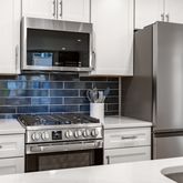 a kitchen with appliances and cabinets