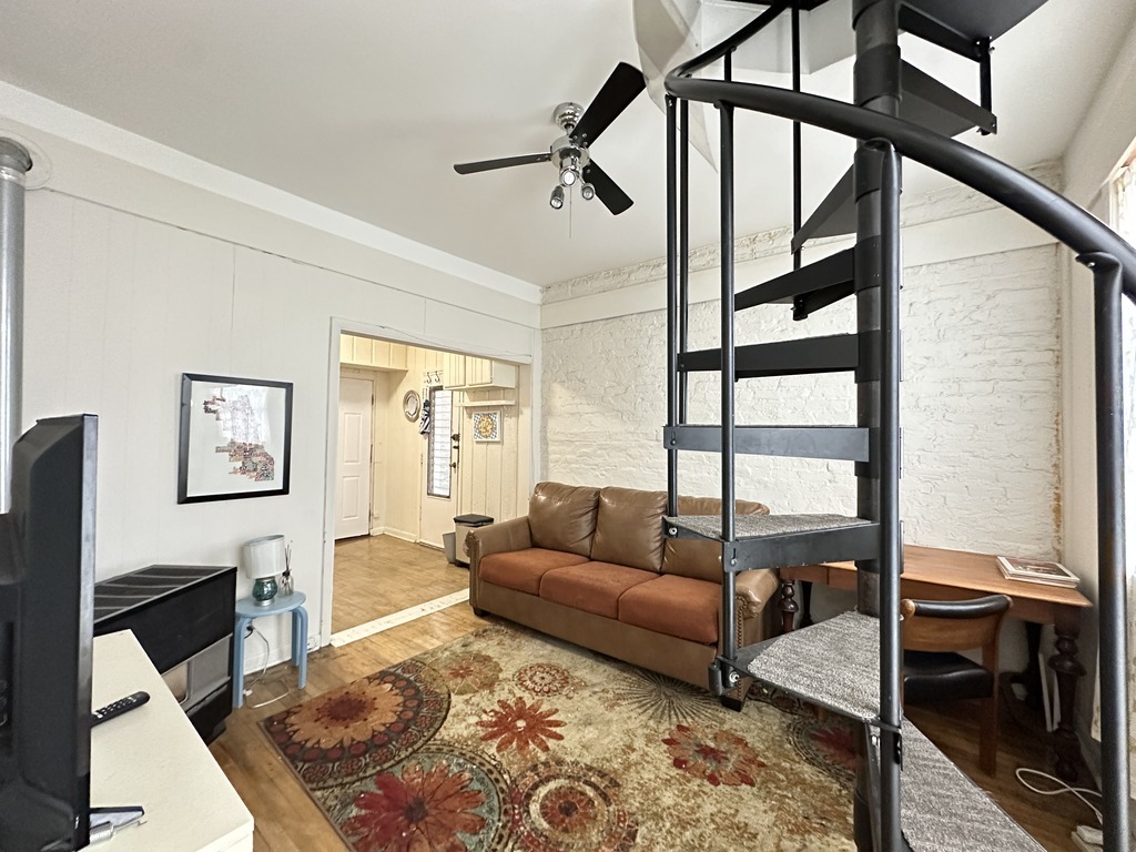 2141 West Webster Avenue, Unit 2R Chicago, IL 60647 - Photo 12 of 20 a living room with furniture and a window