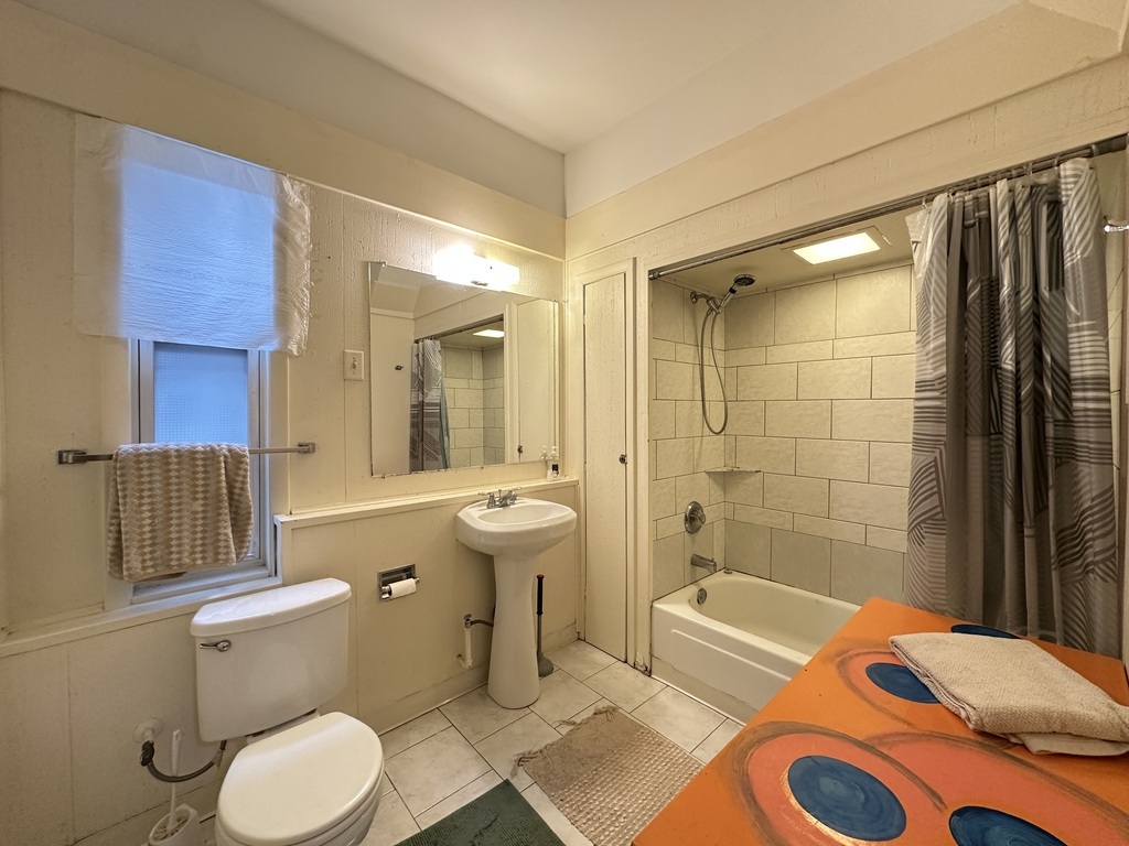 2141 West Webster Avenue, Unit 2R Chicago, IL 60647 - Photo 19 of 20 a bathroom with a sink toilet and shower