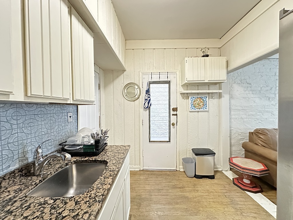 2141 West Webster Avenue, Unit 2R Chicago, IL 60647 - Photo 6 of 20 a kitchen with a stove a sink and a refrigerator