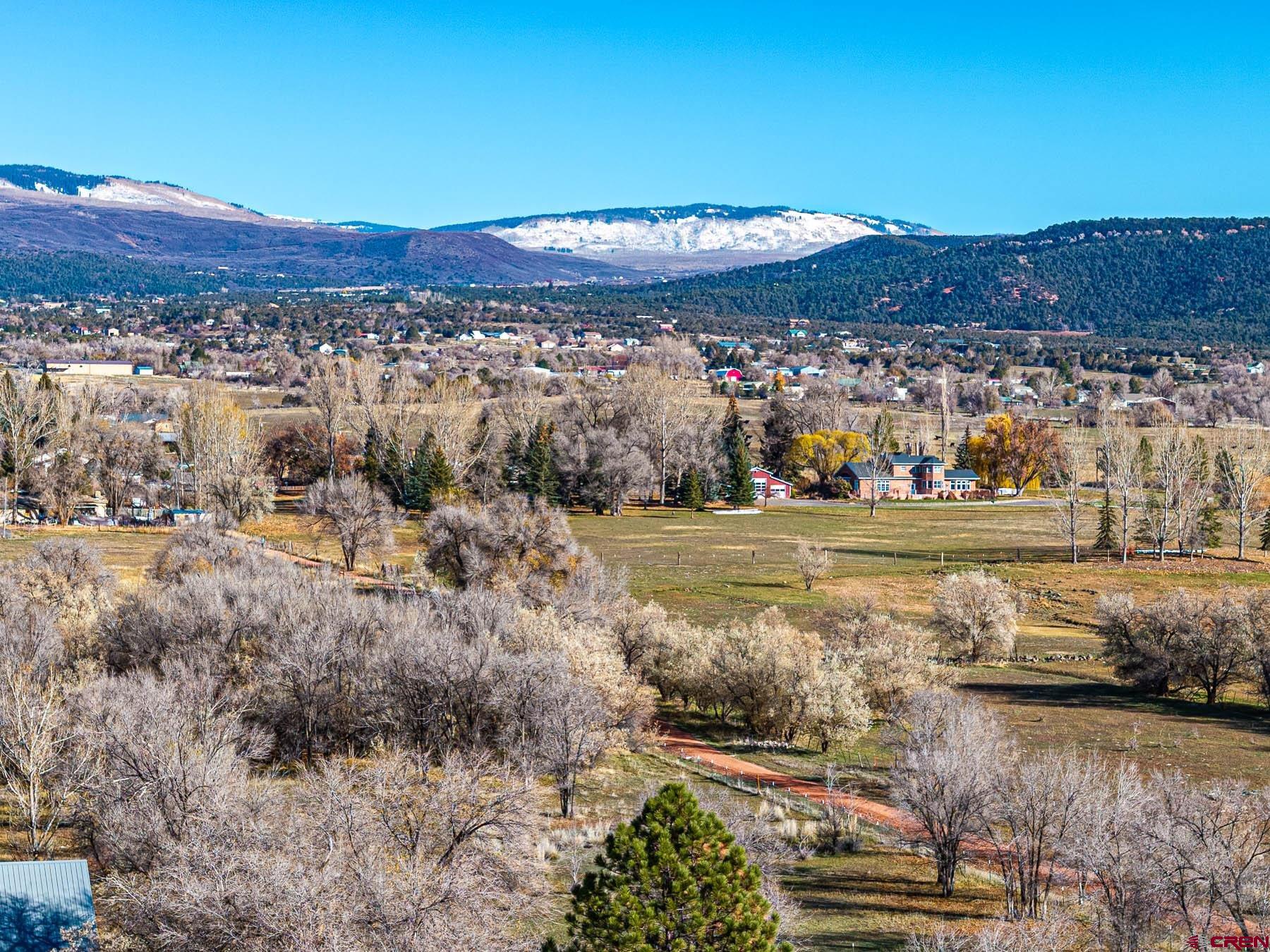 520 Southeast Stonebridge Drive Cedaredge, CO 81413 - Photo 12 of 15 a view of a lake with a mountain