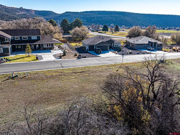 a view of a swimming pool with an outdoor seating