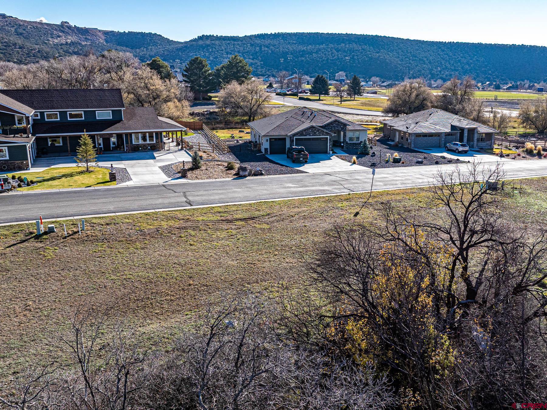 520 Southeast Stonebridge Drive Cedaredge, CO 81413 - Photo 2 of 15 a view of a swimming pool with an outdoor seating