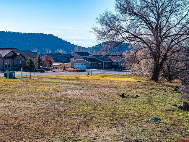 a view of a swimming pool with an outdoor seating