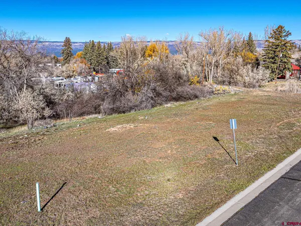 a view of a field of mountains and lake view