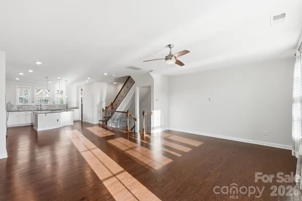 a view of a balcony with furniture and wooden floor