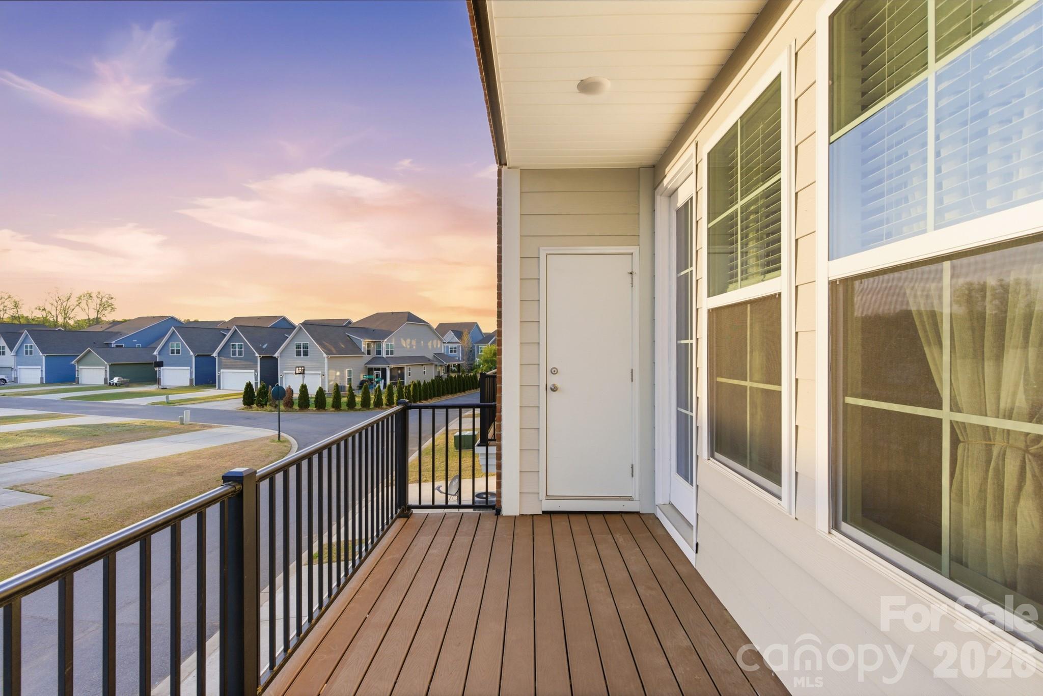 11515 Red Rust Lane Charlotte, NC 28277 - Photo 26 of 48 a view of a balcony with wooden floor and fence