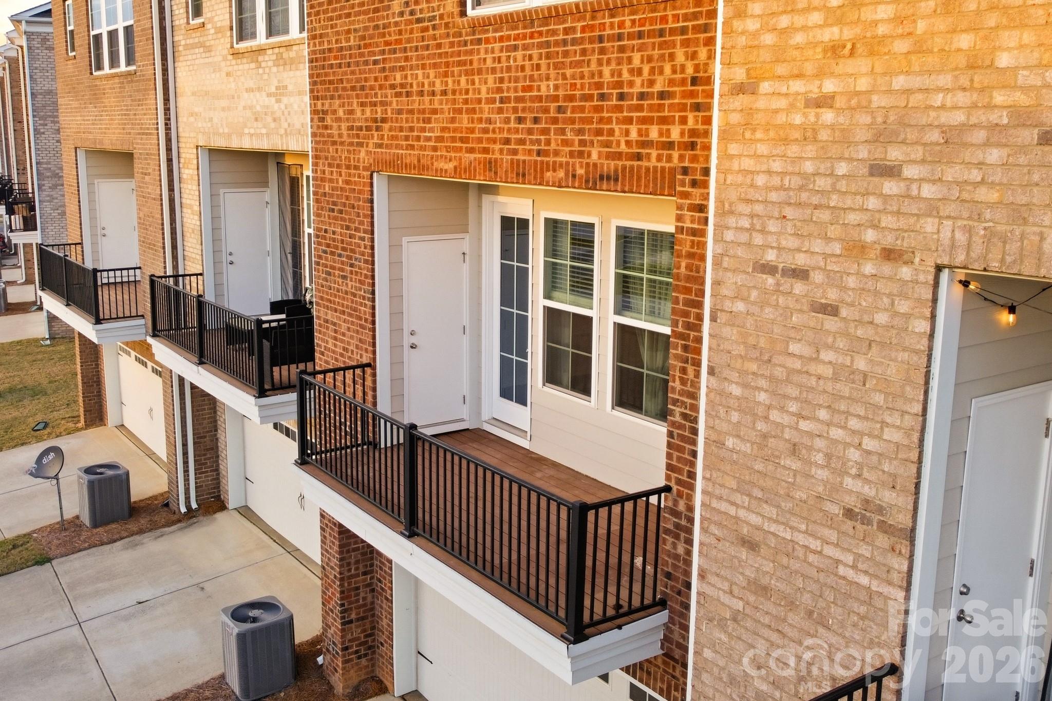 11515 Red Rust Lane Charlotte, NC 28277 - Photo 27 of 48 a view of a balcony with furniture and wooden floor
