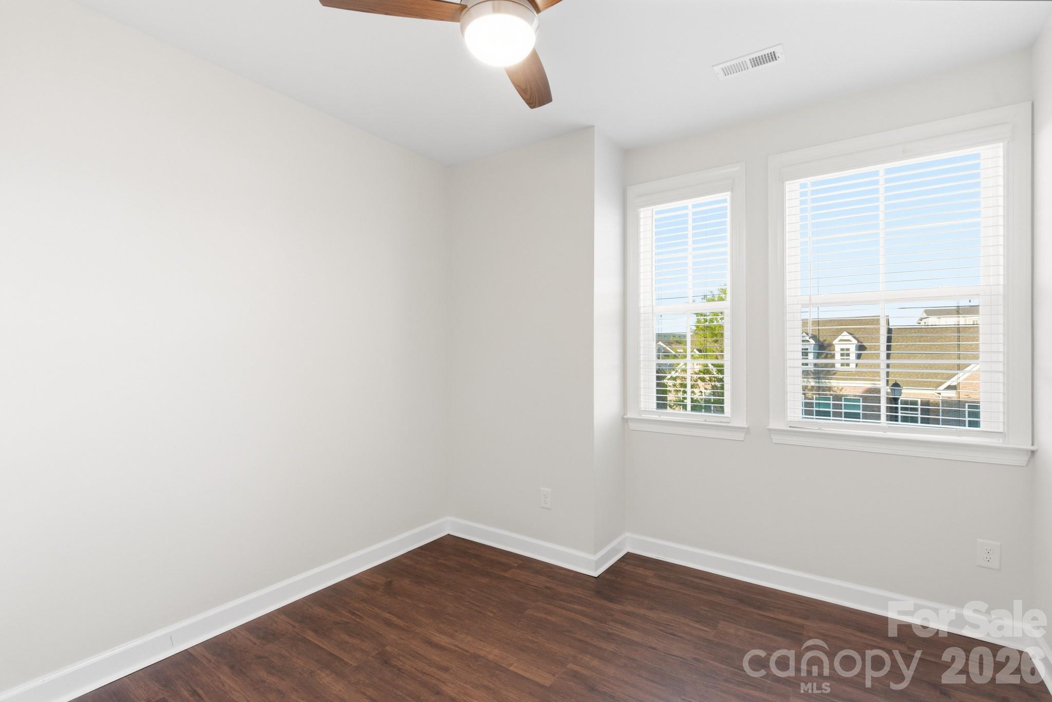 11515 Red Rust Lane Charlotte, NC 28277 - Photo 39 of 48 an empty room with wooden floor and windows