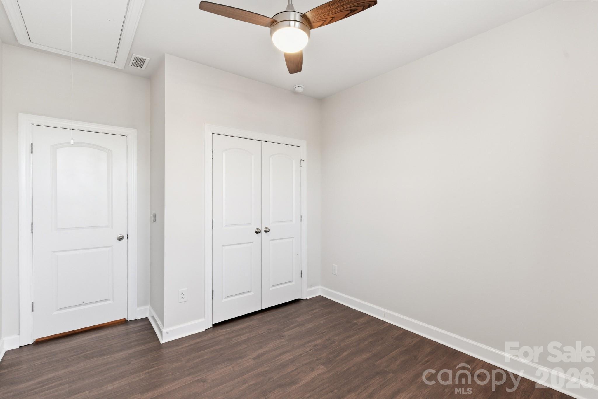 11515 Red Rust Lane Charlotte, NC 28277 - Photo 40 of 48 a view of an empty room with wooden floor