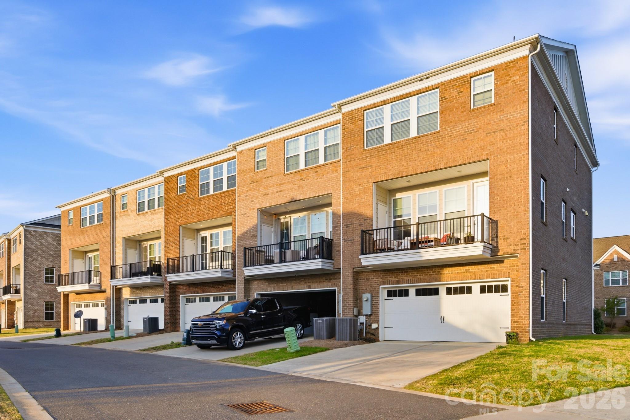 11515 Red Rust Lane Charlotte, NC 28277 - Photo 45 of 48 a front view of a building with street