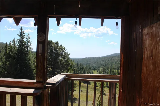 a view of a balcony with a tree