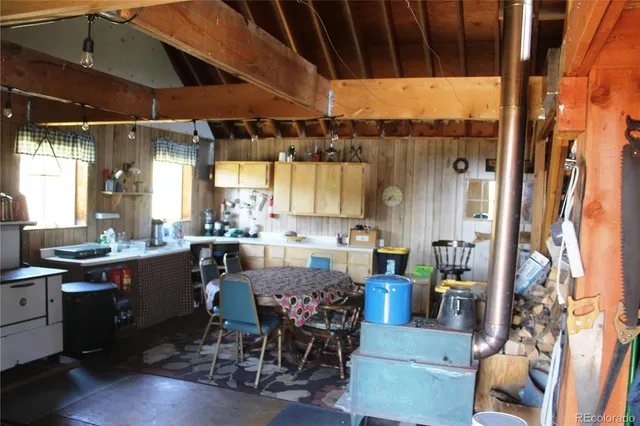 a room with lots of wooden furniture and appliances