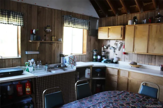 a kitchen with a sink appliances and cabinets