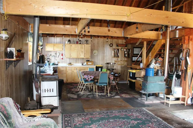 a building outdoor space with patio furniture and potted plants