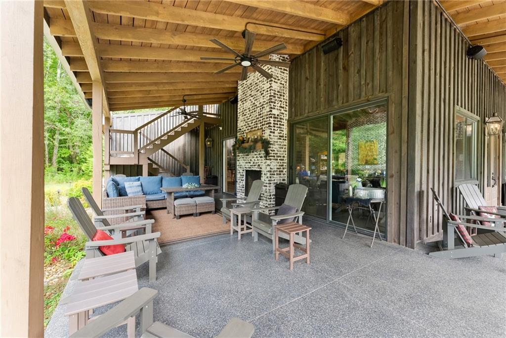 253 Happy Trails Way Jasper, GA 30143 - Photo 15 of 97 a building outdoor space with patio furniture and potted plants