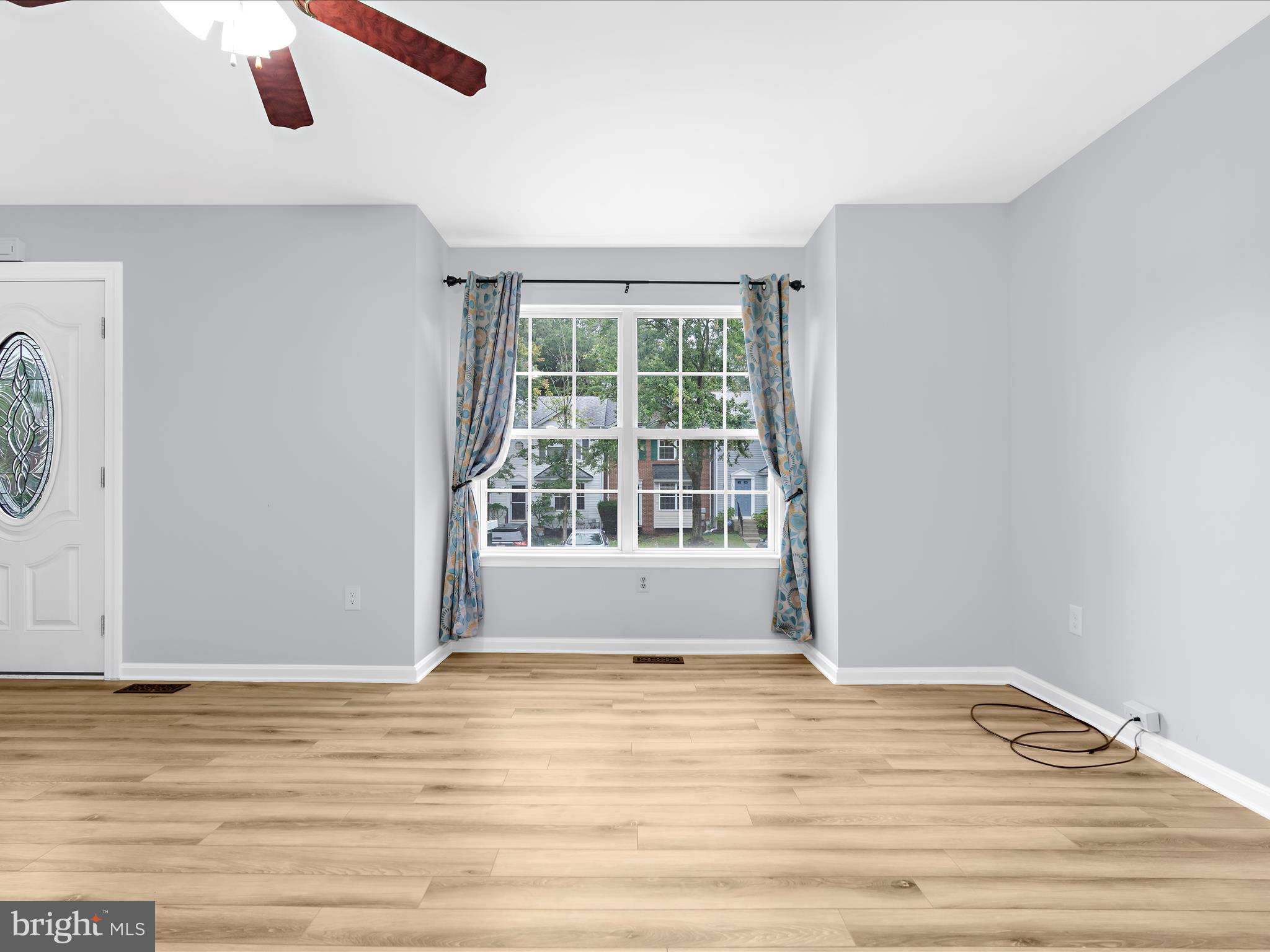 116 Langdon Farm Circle Odenton, MD 21113 - Photo 5 of 60 a view of empty room with wooden floor and fan
