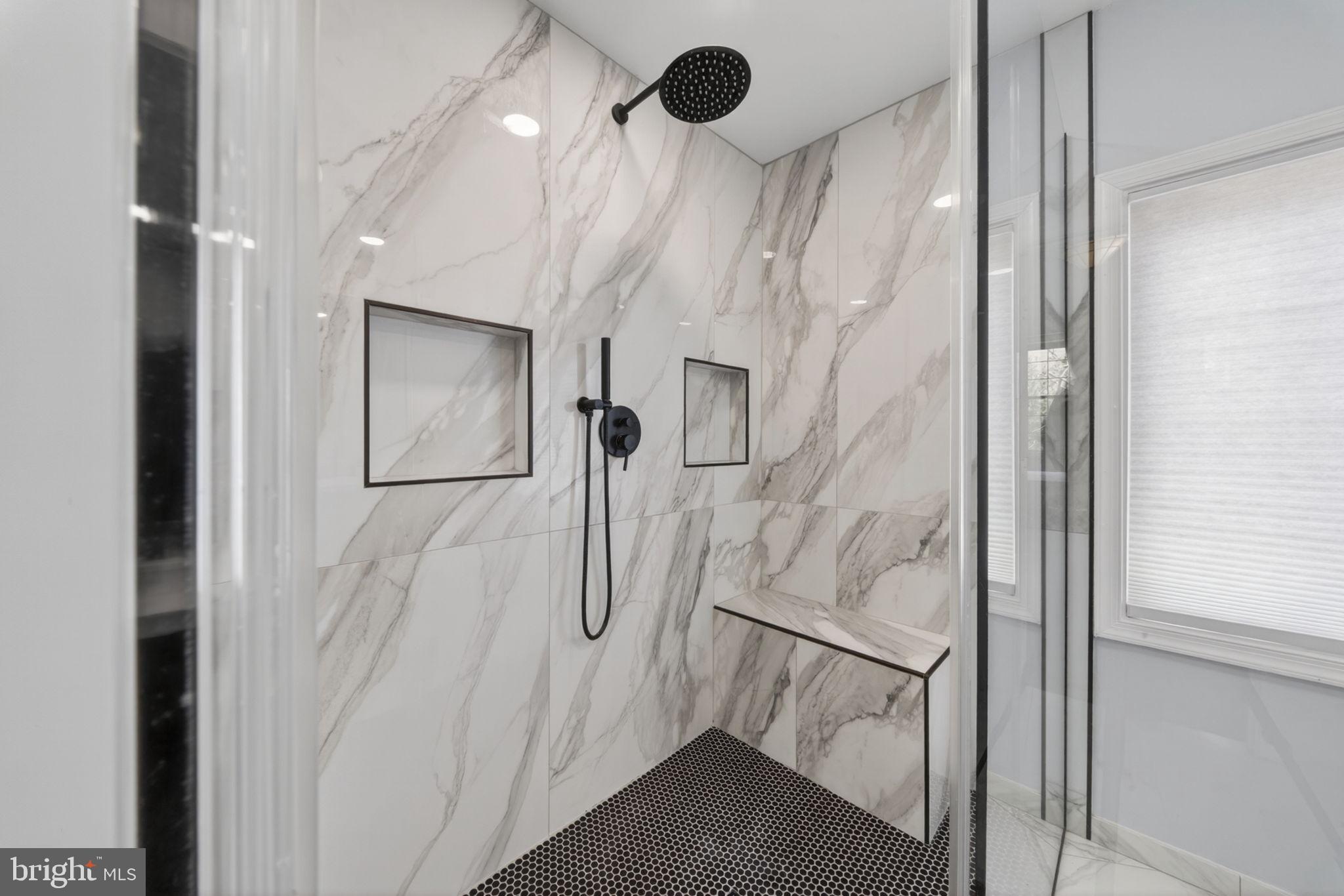 6006 Lincolnia Road Alexandria, VA 22312 - Photo 29 of 42 Sleek marble shower with modern fixtures.
