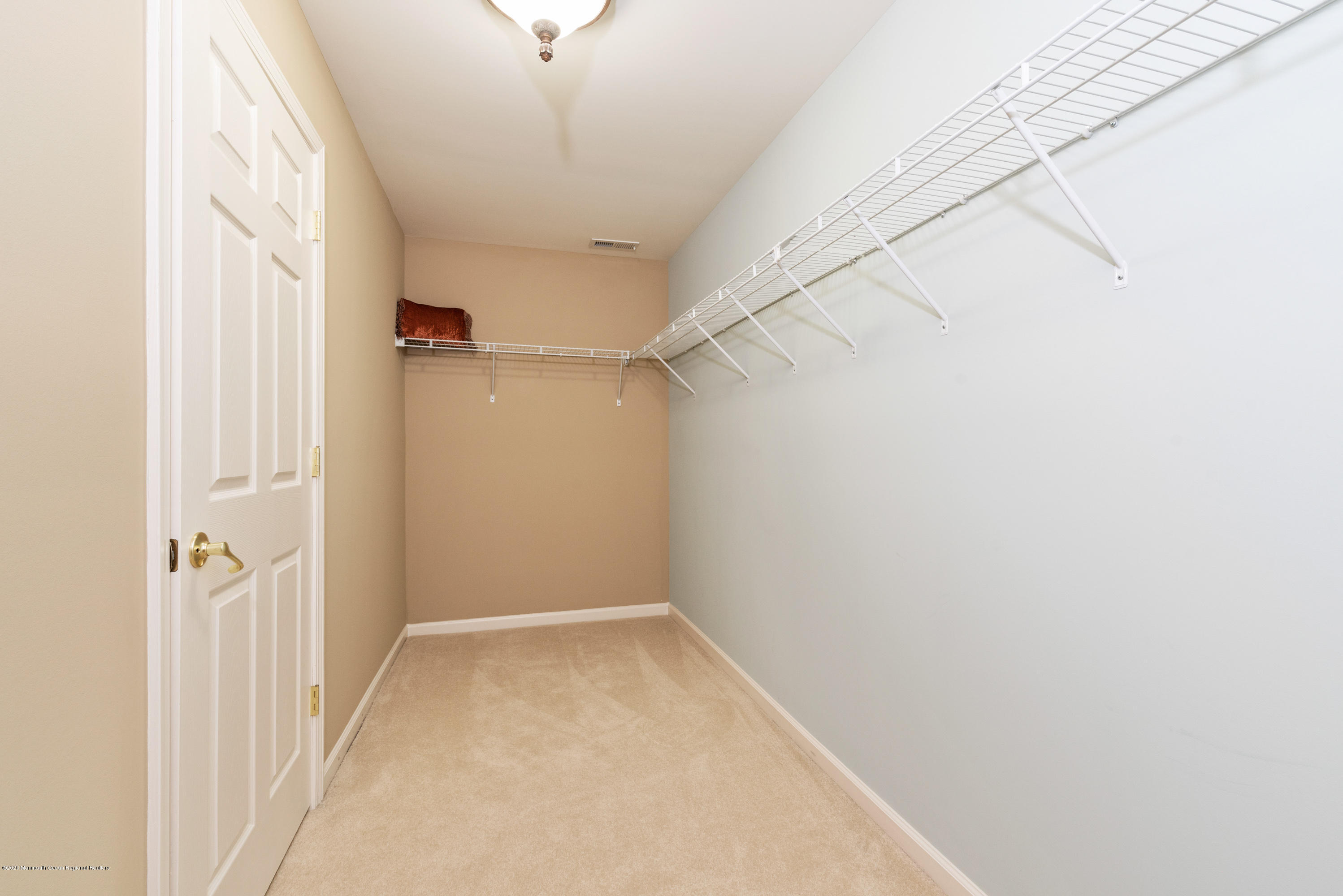 1 Bellagio Road Jackson, NJ 08527 - Photo 20 of 48 a view of a hallway with a white walls