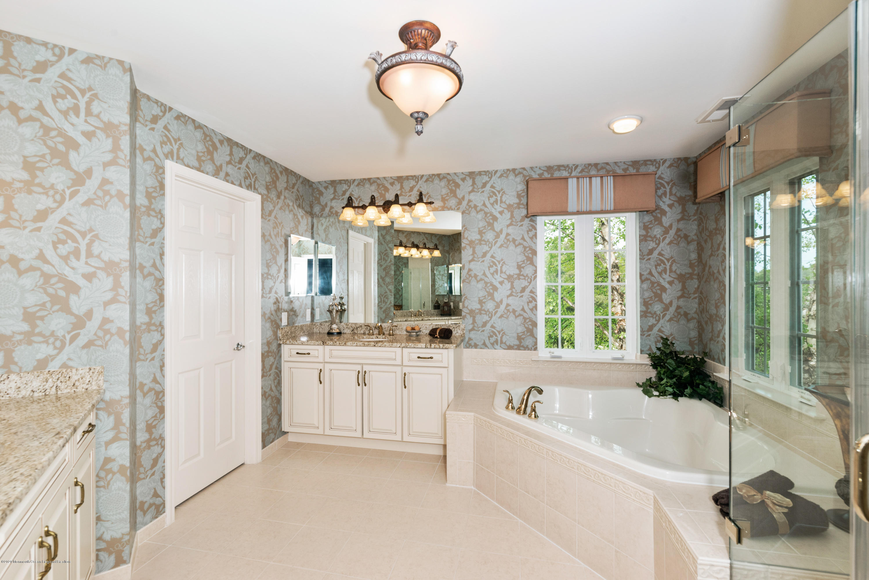 1 Bellagio Road Jackson, NJ 08527 - Photo 21 of 48 a bathroom with a granite countertop sink mirror bathtub and next to a window