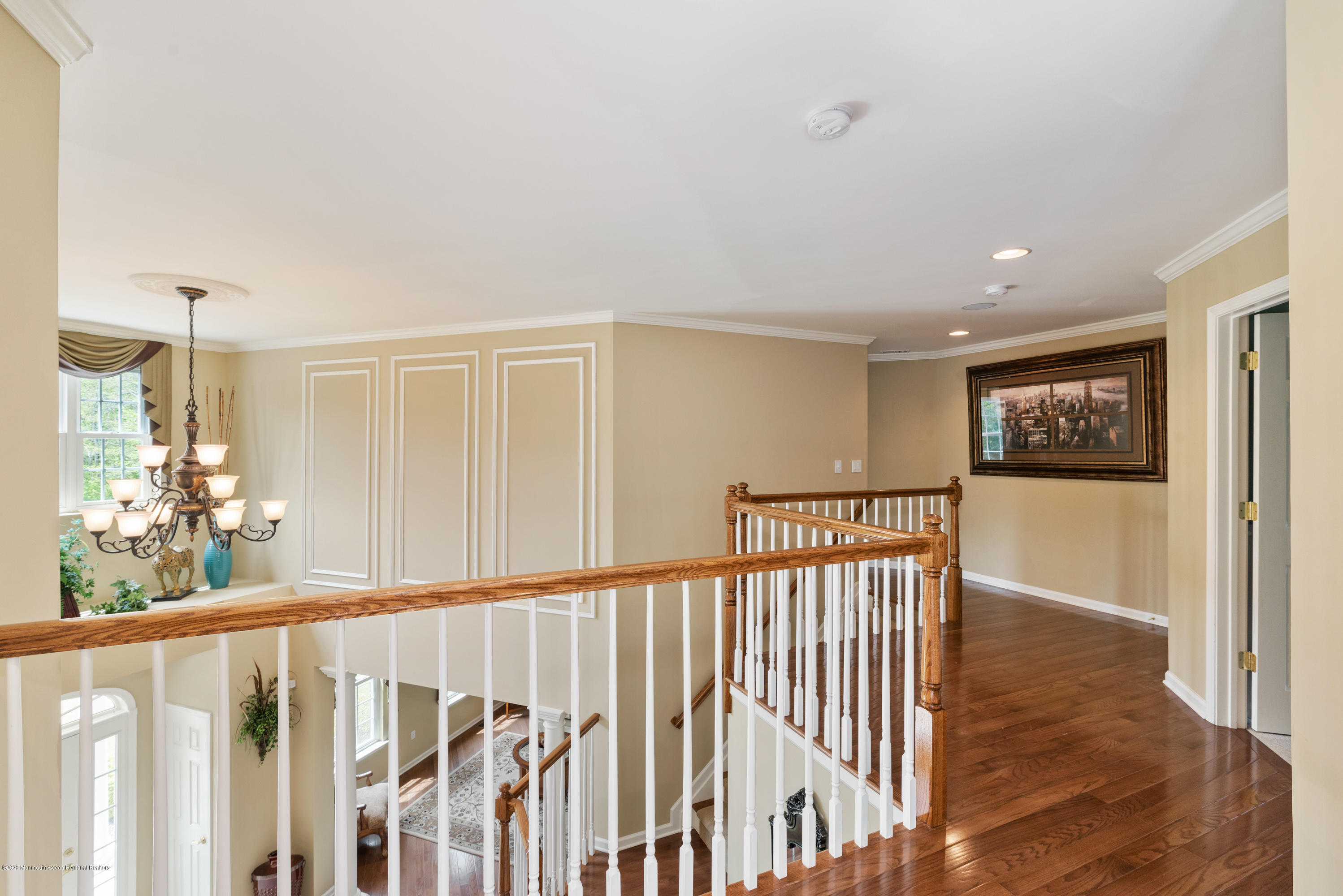 1 Bellagio Road Jackson, NJ 08527 - Photo 32 of 48 a view of a hallway with wooden floor and windows