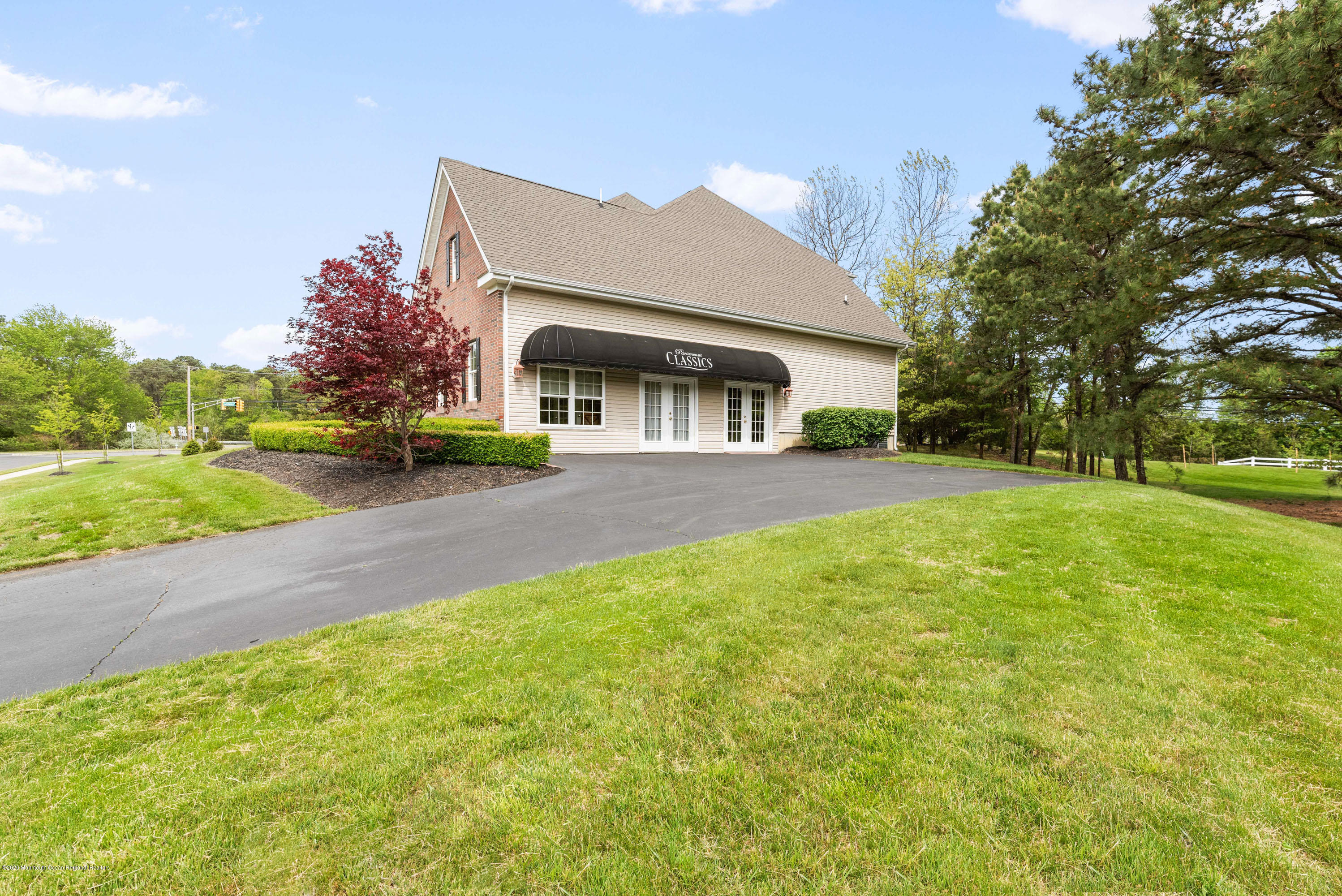1 Bellagio Road Jackson, NJ 08527 - Photo 34 of 48 a view of a house with a big yard and large trees