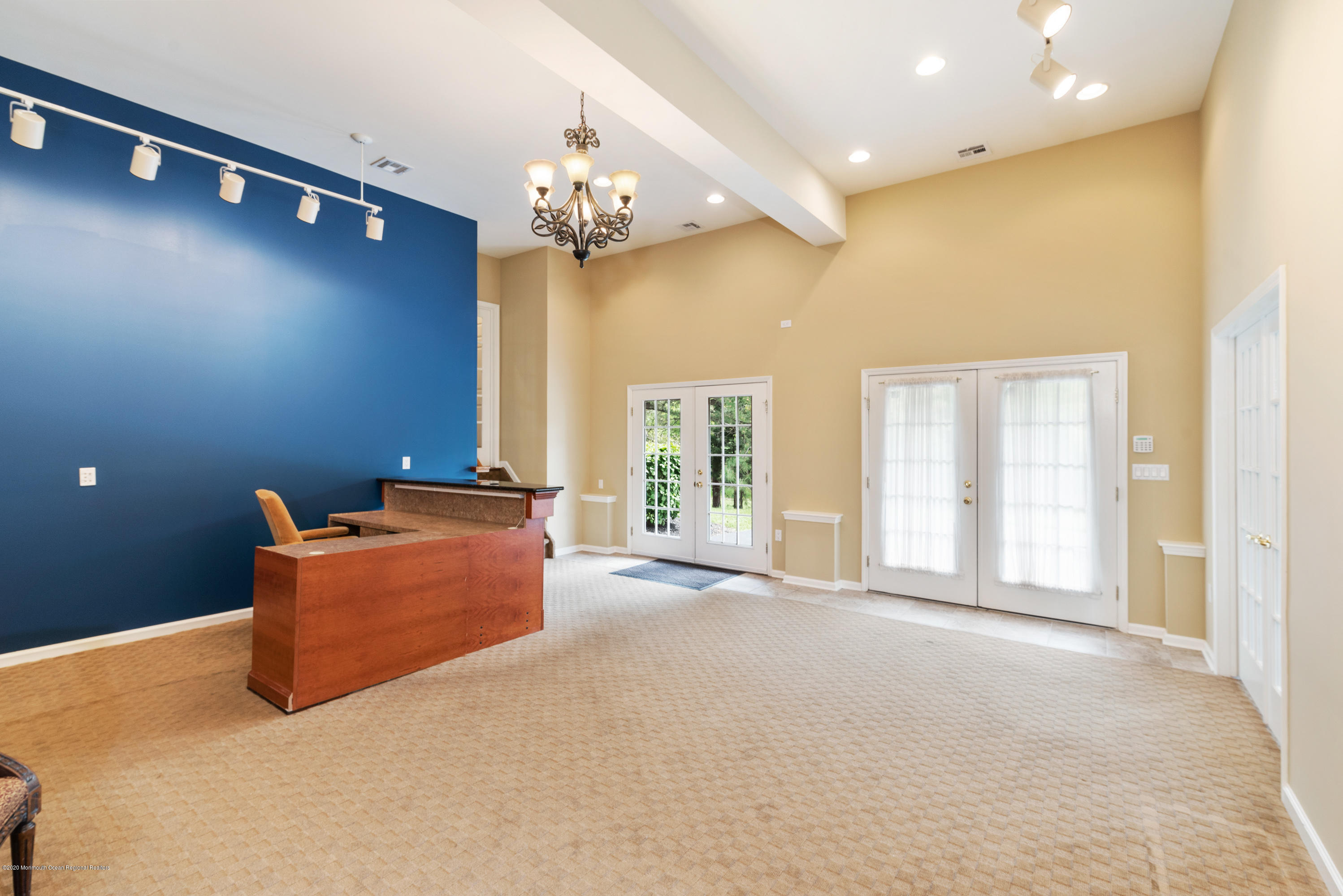 1 Bellagio Road Jackson, NJ 08527 - Photo 36 of 48 a living room with furniture and a chandelier