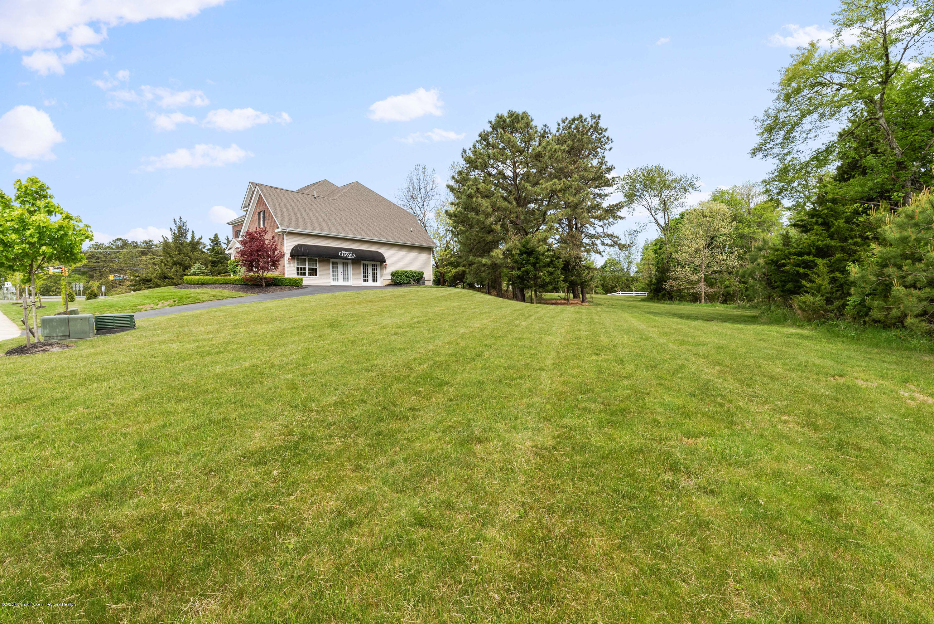 1 Bellagio Road Jackson, NJ 08527 - Photo 38 of 48 a view of a big yard with a house in the background