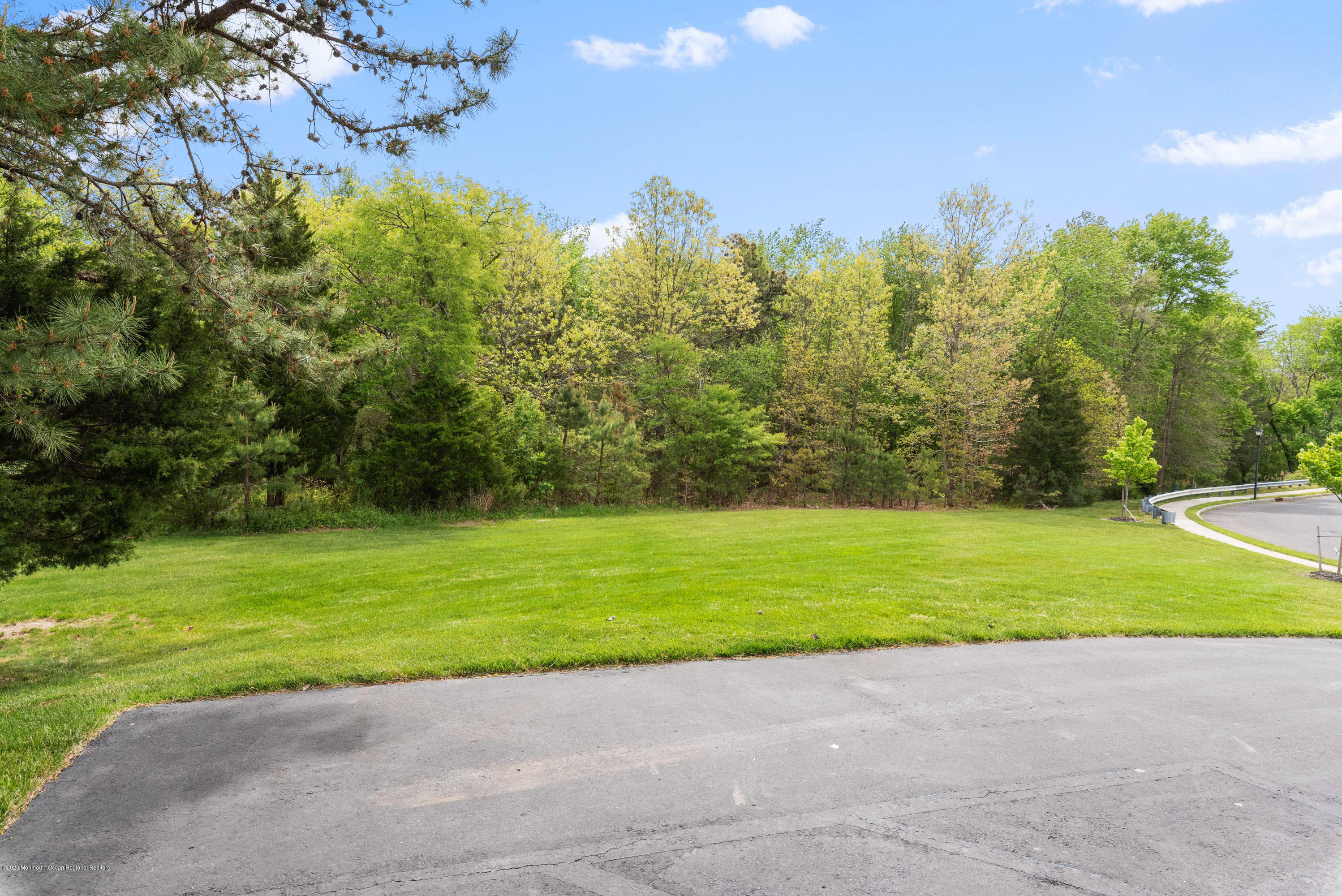 1 Bellagio Road Jackson, NJ 08527 - Photo 40 of 48 a view of a yard and a house in the background