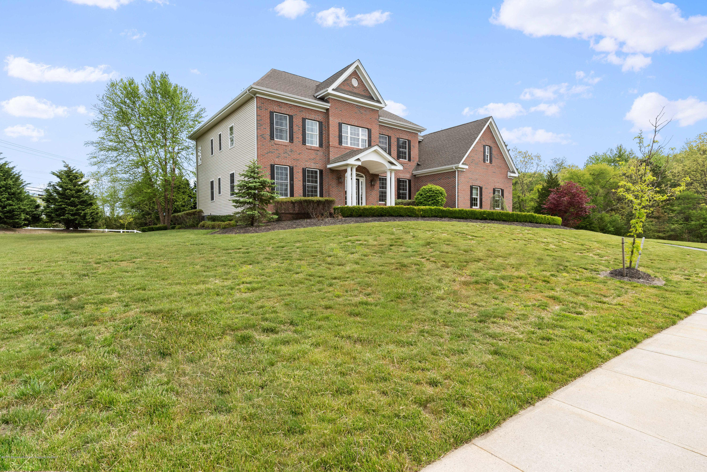 1 Bellagio Road Jackson, NJ 08527 - Photo 47 of 48 a front view of a house with a yard