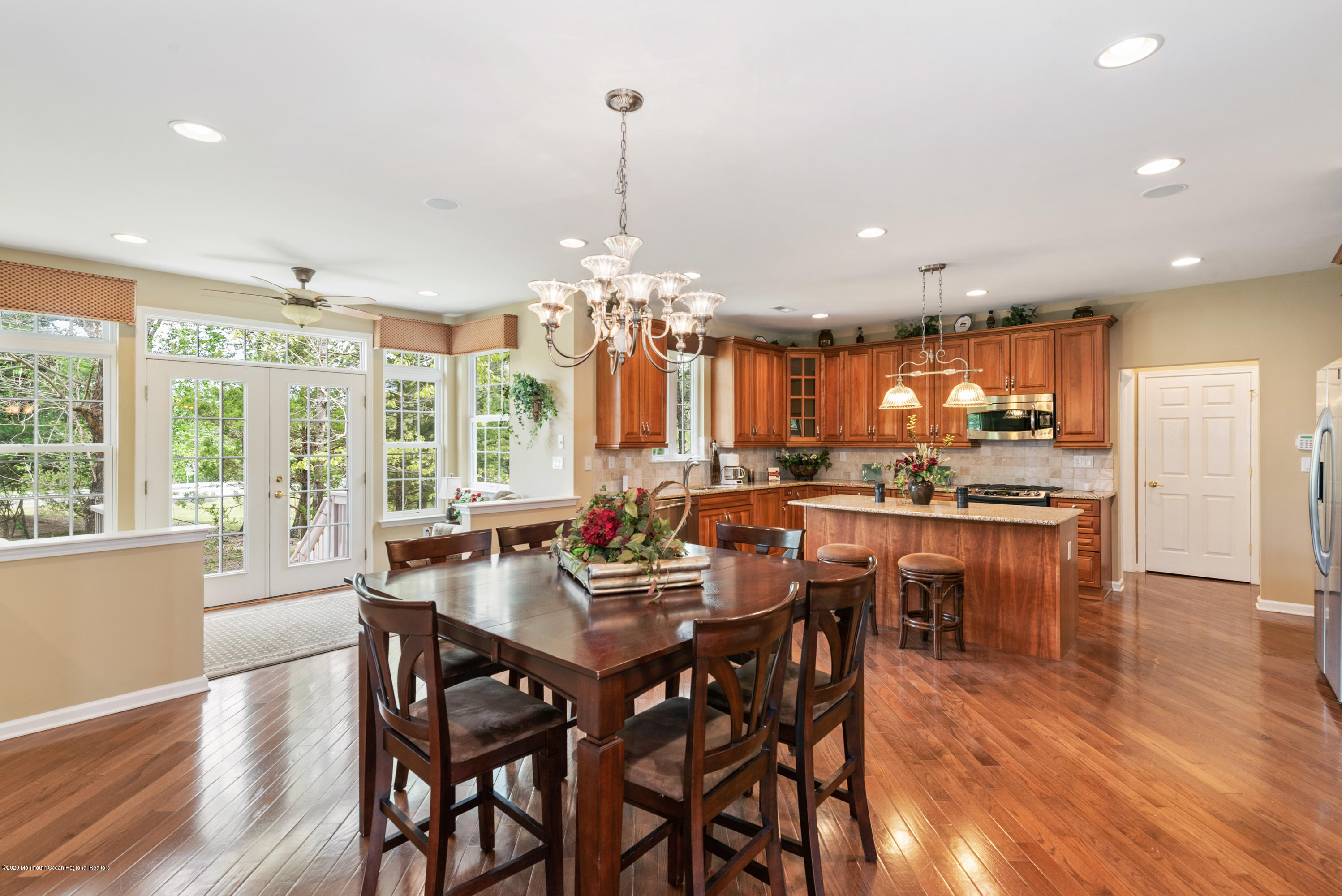 1 Bellagio Road Jackson, NJ 08527 - Photo 6 of 48 a view of a dining room and livingroom with furniture wooden floor a chandelier