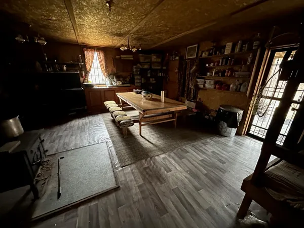 a living room with lots of furniture and a wooden floor