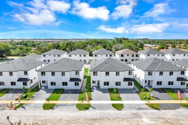 an aerial view of a house with swimming pool