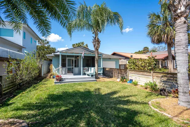 a front view of a house with swimming pool having outdoor seating