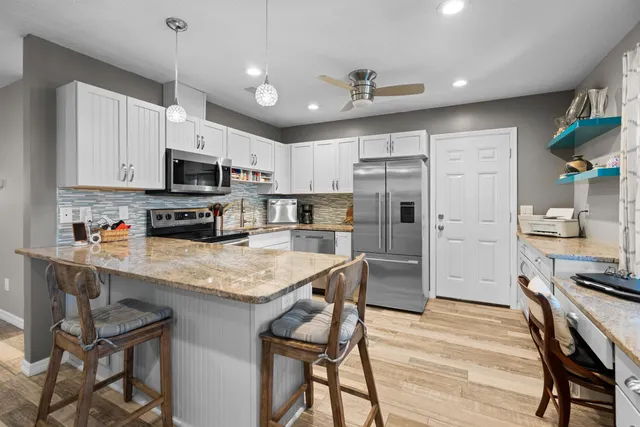 a room with furniture and a flat screen tv