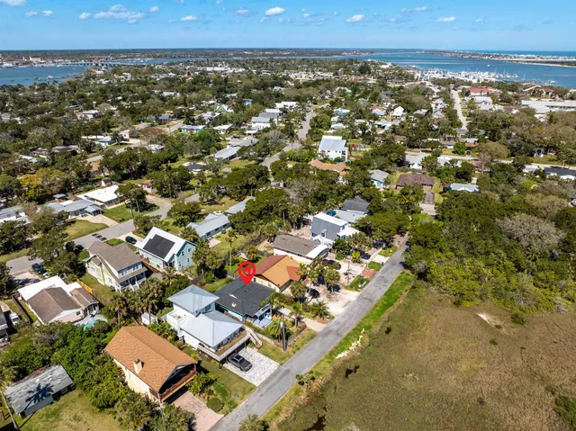 an aerial view of residential houses with outdoor space