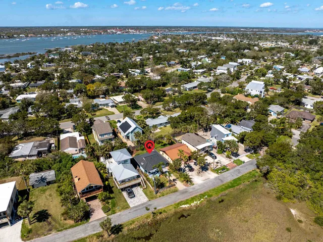 an aerial view of residential houses with outdoor space