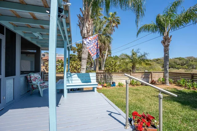 a view of a two chairs in the balcony