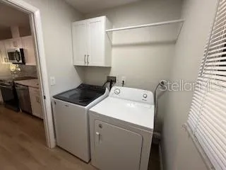 a view of storage and utility room with washer and dryer