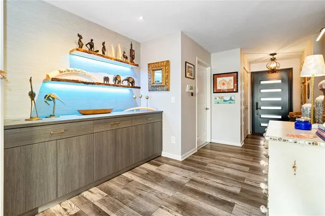 a kitchen with a cabinets and wooden floor