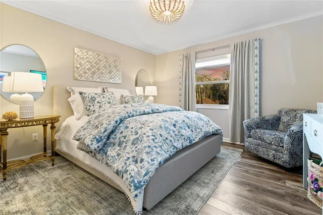 a bedroom with bed and a window