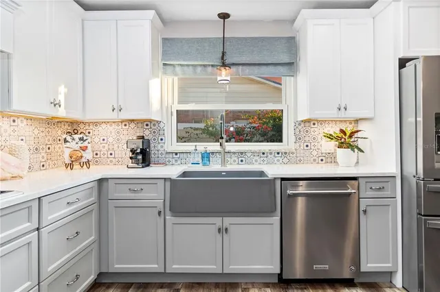 a kitchen with a sink and cabinets