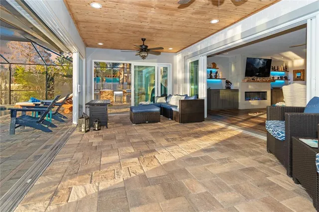 a lobby with furniture and large windows