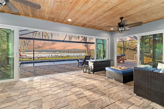 a view of a patio with a table and chairs