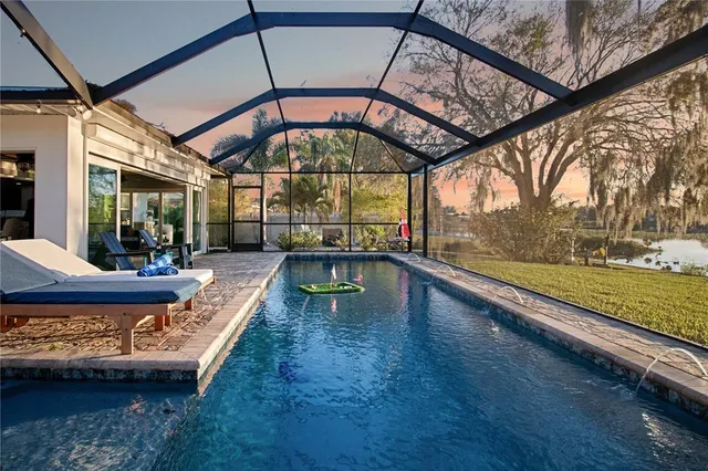a view of a swimming pool with a patio