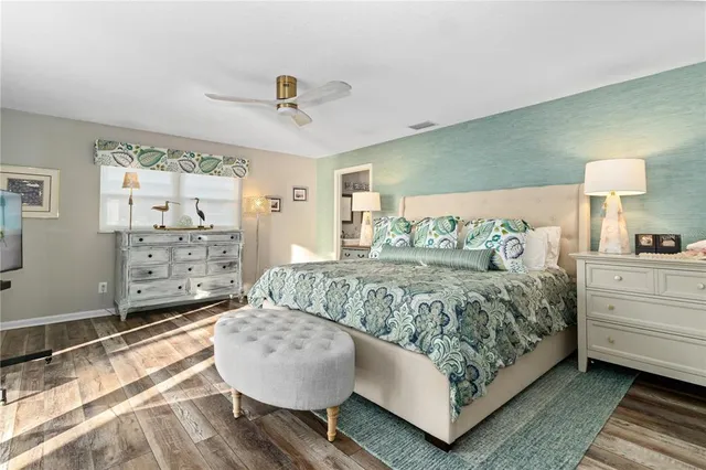 a bedroom with a large bed and a window