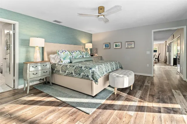 a bedroom with a bed and a mirror