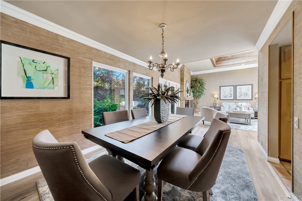 23802 Cassandra Bay Dana Point, CA 92629 - Photo 19 of 48 a view of a dining room with furniture wooden floor and chandelier