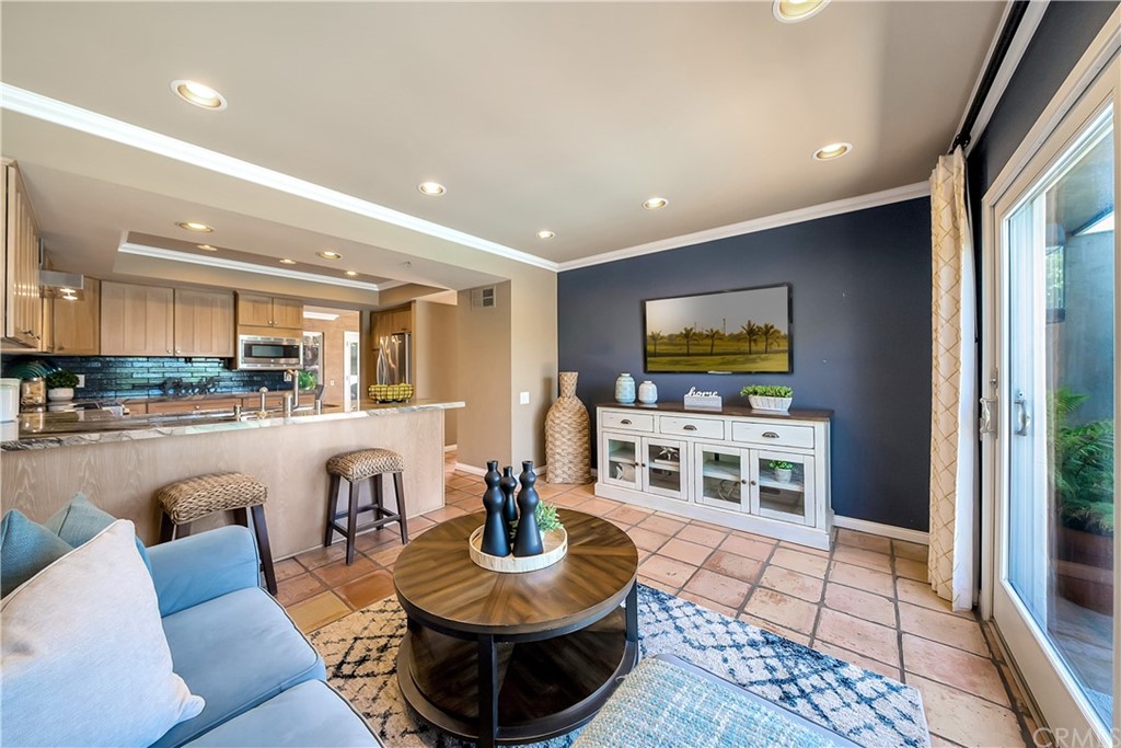 23802 Cassandra Bay Dana Point, CA 92629 - Photo 29 of 48 a living room with furniture a rug and a flat screen tv